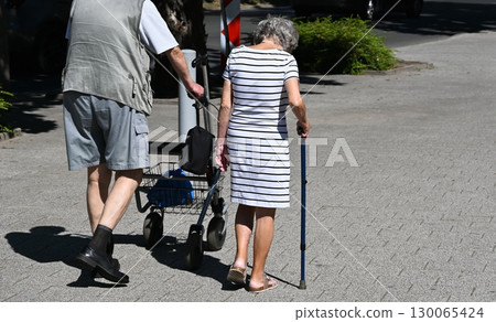 Old couple are walking on the street 130065424