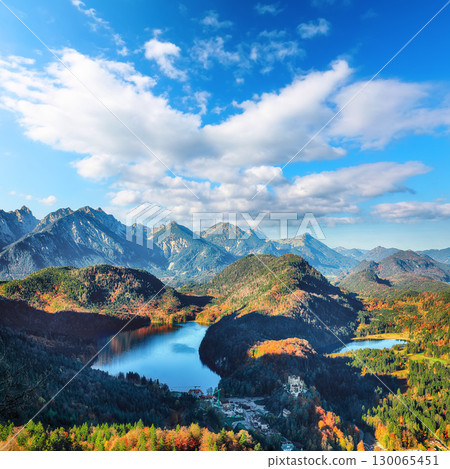 Astonishing Top view panorama of Alpsee and Schwangau village in autumn. 130065451