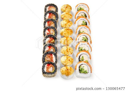 Sushi rolls forming vertical lines on white background 130065477