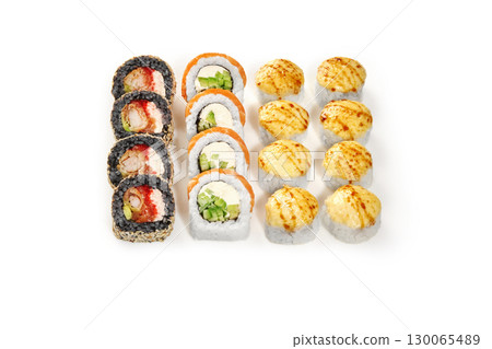 Sushi set displaying variety of rolls and nigiri on white background Sushi set displaying variety of rolls and nigiri on white background 130065489