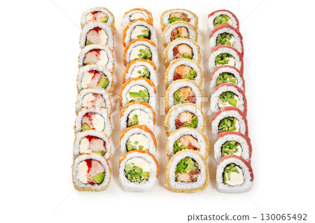 Four rows of delicious uramaki sushi rolls with various ingredients on white background Four rows of delicious uramaki sushi rolls with various ingredients on white background 130065492