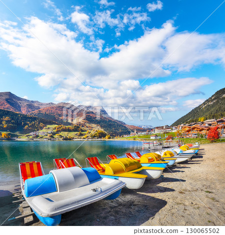Picturesque autumn view of San Valentino village and Muta or Haidersee lake. Picturesque autumn view of San Valentino village and Muta or Haidersee lake. 130065502