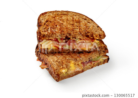 Toasted bacon, cheddar, and pickle sandwich on rye bread 130065517