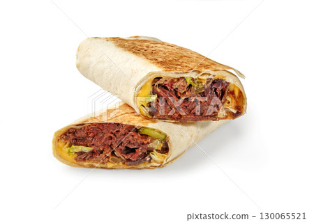 Two halves of delicious juicy shawarma sandwich with beef, pickles and cheddar cheese lying on top of each other Two halves of delicious juicy shawarma sandwich with beef, pickles and cheddar cheese lying on top of each other 130065521