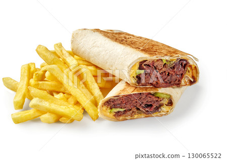 Delicious shawarma and french fries presenting a tasty culinary combination Delicious shawarma and french fries presenting a tasty culinary combination 130065522
