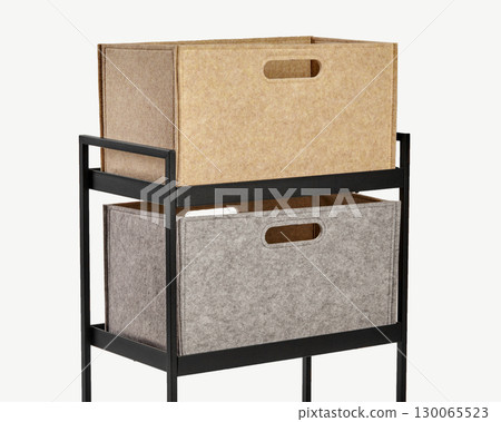 Modern black metal shelving unit with beige and gray felt storage boxes Modern black metal shelving unit with beige and gray felt storage boxes 130065523