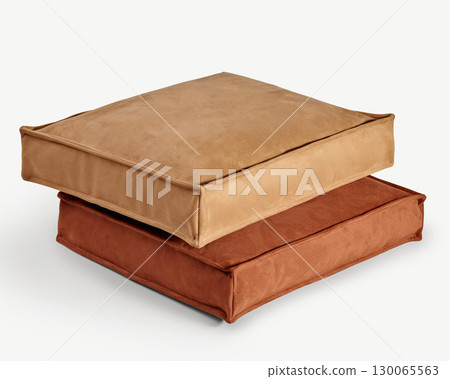 Two square floor cushions stacked on white background, showing comfort and style Two square floor cushions stacked on white background, showing comfort and style 130065563