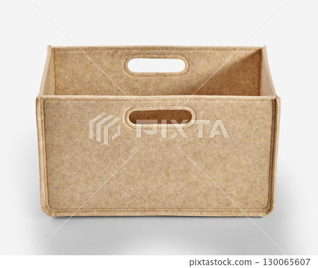 Empty beige felt storage box with handles on white background 130065607