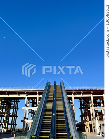 Osaka-Kansai Expo 2025: Large roof ring and escalators rising into the sky Osaka-Kansai Expo 2025: Large roof ring and escalators rising into the sky 130065612