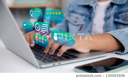 Customer review rating and feedback concept with five star icons on laptop screen 130065696
