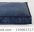 Empty modern washable pet bed resting on white background 130065717
