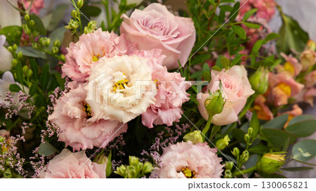 Delicate pink roses and lisianthus composing a stunning bouquet in Cardiff 130065821