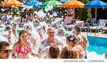 Joyful Pool Party Celebration With Friends Splashing Water Under Colorful Beach Umbrellas 130065844