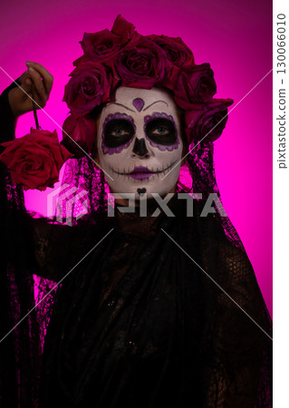 Girl in Calavera Makeup With a Rose for the Day of the Dead 130066010