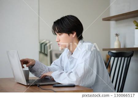 Young Asian man working from home 130066517