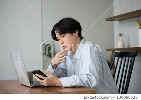 Young Asian man working from home 130066520