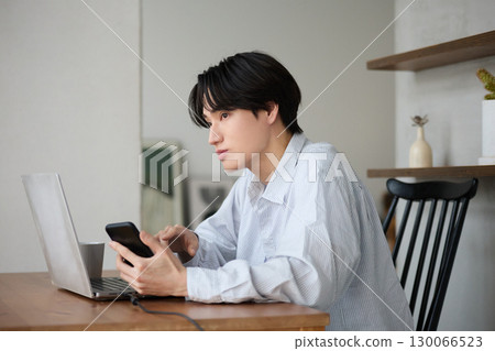 Young Asian man working from home 130066523