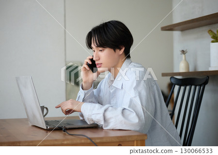 Young asian man working from homeYoung asian man working from home Young asian man working from homeYoung asian man working from home 130066533