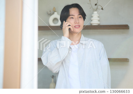 Young Asian man working from home Young Asian man working from home 130066633