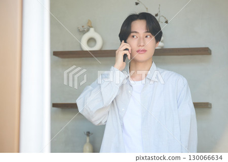 Young Asian man working from home Young Asian man working from home 130066634