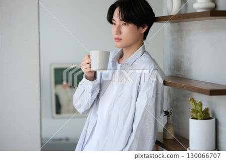 Young Asian man relaxing at home 130066707