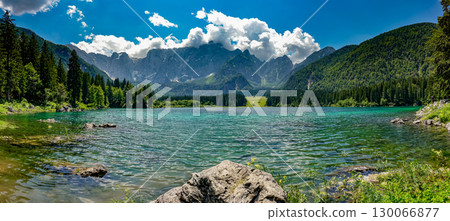 Fusine Lakes pristine turquoise waters surrounded by dramatic Alpine peaks in Friuli Venezia 130066877