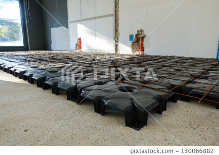 Reinforced Concrete Foundation System with Steel Rebar Grid During Active Building Construction 130066882