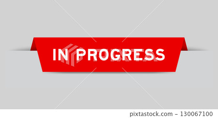 Red color inserted label with word in progress on gray background 130067100