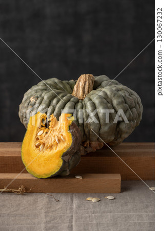 Cut Marina di Chioggia Pumpkin On Dark Background Cut Marina di Chioggia Pumpkin On Dark Background 130067232