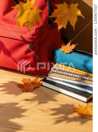 Fresh Start: New Backpack with School Supplies and Autumn Leaves Fresh Start: New Backpack with School Supplies and Autumn Leaves 130067507