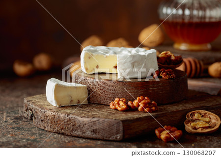 Camembert cheese with walnuts and honey. 130068207