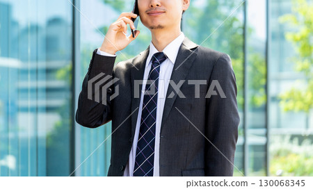 Male businessman talking on a smartphone 130068345