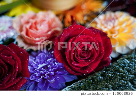 Flowers displayed at the Chozuya (purification fountain) of a temple in Kyoto Flowers displayed at the Chozuya (purification fountain) of a temple in Kyoto 130068926