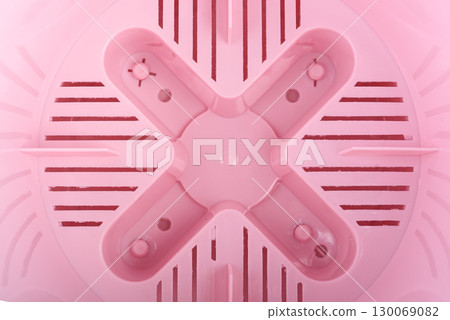 Top view of the bottom of the inside of a plastic empty flower pot. Top view of the bottom of the inside of a plastic empty flower pot. 130069082