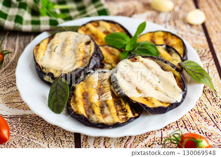 Summer eggplant side dish with herbs and olive oil 130069548