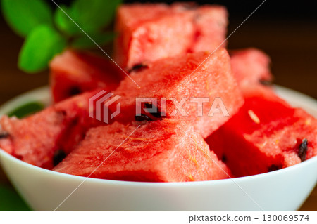 Summer watermelon dessert in a bowl on a dark background 130069574