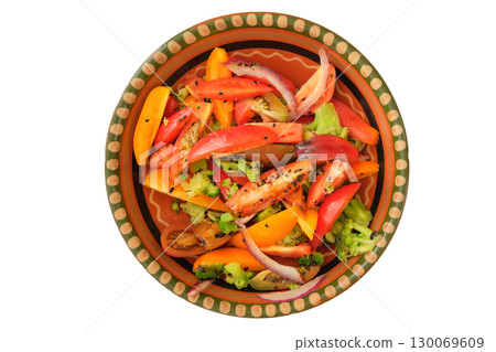 Sliced tomato in rustic bowl. Tomatoes in a clay plate isolate on white background. Salad of fresh tomatoes and other vegetables. Top view. Sliced tomato in rustic bowl. Tomatoes in a clay plate isolate on white background. Salad of fresh tomatoes and other vegetables. Top view. 130069609