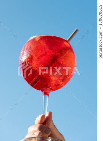 Glass of classic red martini aperol spritz cocktail 130070015