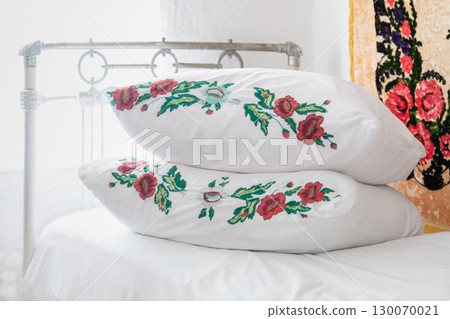 Embroidered pillowcases on an iron bed in the USSR Embroidered pillowcases on an iron bed in the USSR 130070021
