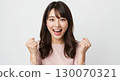 A young Japanese woman smiling and pumping her fist, with an expression full of joy and a sense of accomplishment - diet, passing, joy, happy 130070321