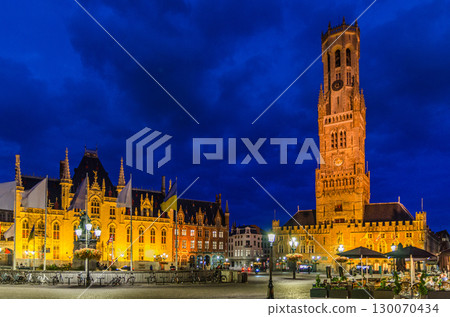 Bruges cityscape, Belfry of Bruges Belfort van Brugge and Provinciaal Hof Provincial Court on Markt Market square in Brugge old town, Bruges city historical centre in evening, Flemish Region, Belgium 130070434