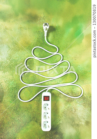 A power strip is arranged in the shape of a Christmas tree, artistically placed on a vibrant green and yellow backdrop. The design adds a playful touch to the festive atmosphere. A power strip is arranged in the shape of a Christmas tree, artistically placed on a vibrant green and yellow backdrop. The design adds a playful touch to the festive atmosphere. 130070819