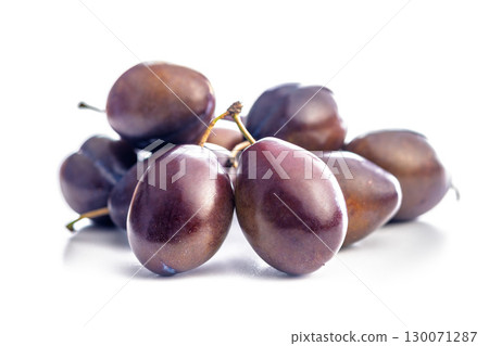 Ripe plums isolated on white background. Ripe plums isolated on white background. 130071287