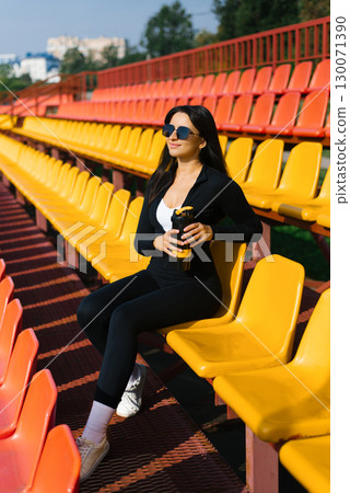 Woman In Sunglasses With Shaker Woman In Sunglasses With Shaker 130071390