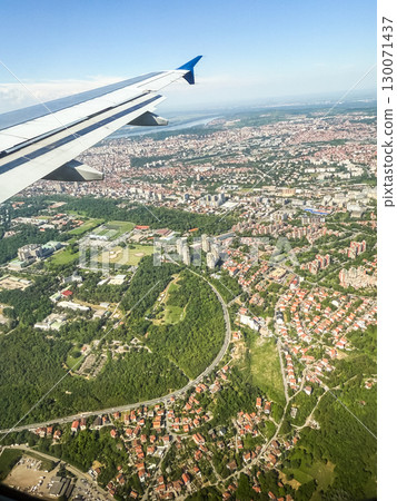 Aerial view of Belgrade city from airplane. Urban development, architecture and infrastructure of modern metropolitan area. 130071437