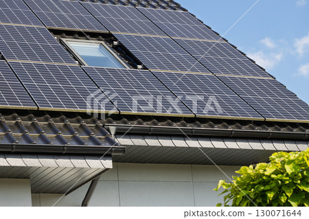 Photovoltaic solar panels on sloped roof 130071644