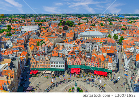Aerial panoramic view of Bruges historical city centre, Markt Market square, old buildings, traditional colourful Flemish style townhouses, skyline horizon panorama of Brugge old town, Belgium 130071652