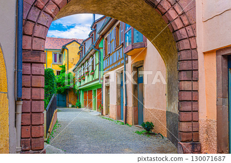 Small cozy courtyard with old colorful houses medieval buildings half-timbered style with multicolored walls and green plants in old town Colmar city historic centre, Alsace Grand Est region, France Small cozy courtyard with old colorful houses medieval buildings half-timbered style with multicolored walls and green plants in old town Colmar city historic centre, Alsace Grand Est region, France 130071687