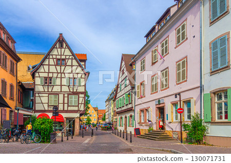 Old town Colmar city historic centre Grand Rue street with old houses medieval buildings half-timbered style colorful facade with shutters windows in summer day, Alsace Grand Est region, France 130071731