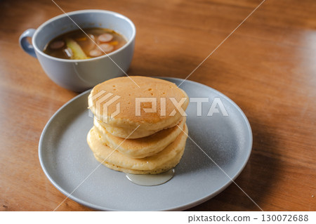 Western-style breakfast of pancakes and syrup with sausage soup 130072688